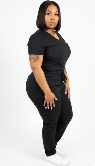 Person wearing a black outfit on a white background